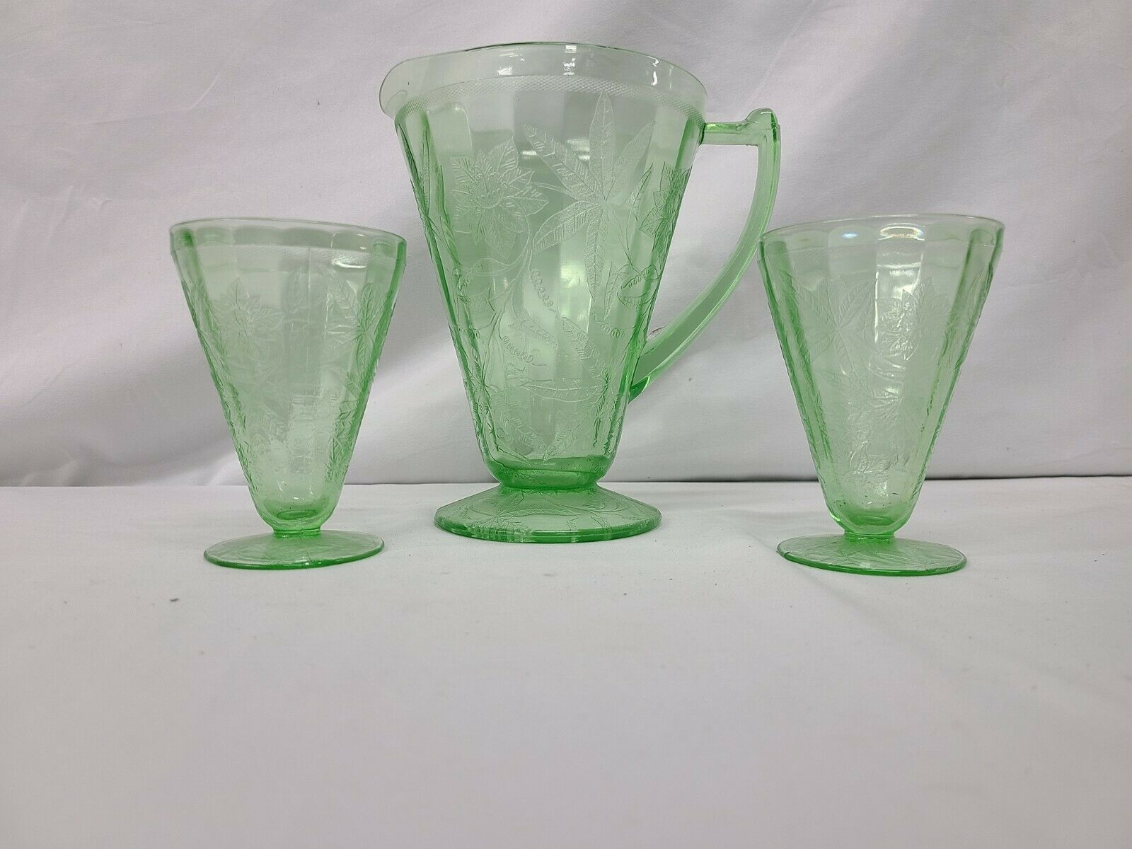 Lot Of Jeannette Glass Co. Floral Poinsettia Footed Pitcher And Footed Tumblers